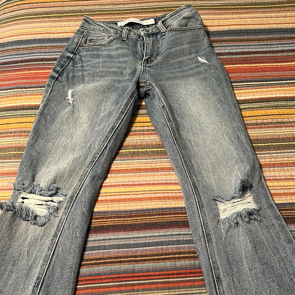 Tinseltown jeans NWOT. Light blue with distressing on the front.